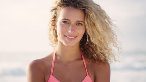 Woman,-face-and-smile-by-beach-in-summer