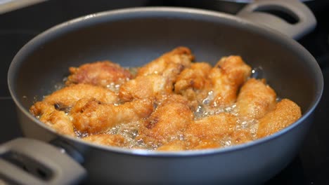 fried chicken wings in a pan