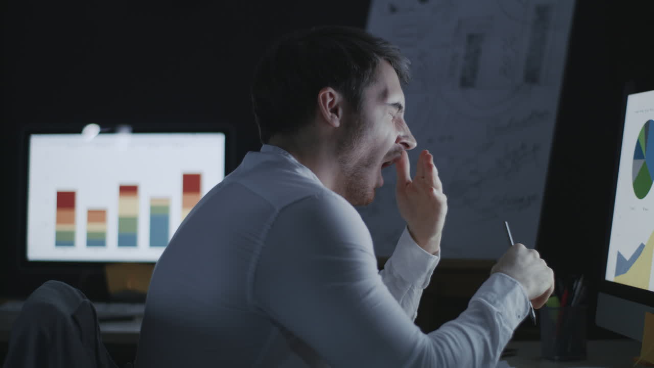 Overworked business analyst yawning