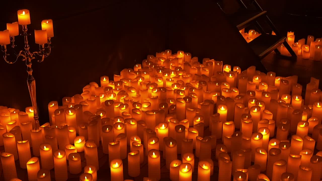 warm candlelight fills the room in a calming night atmosphere with soft flickering flames