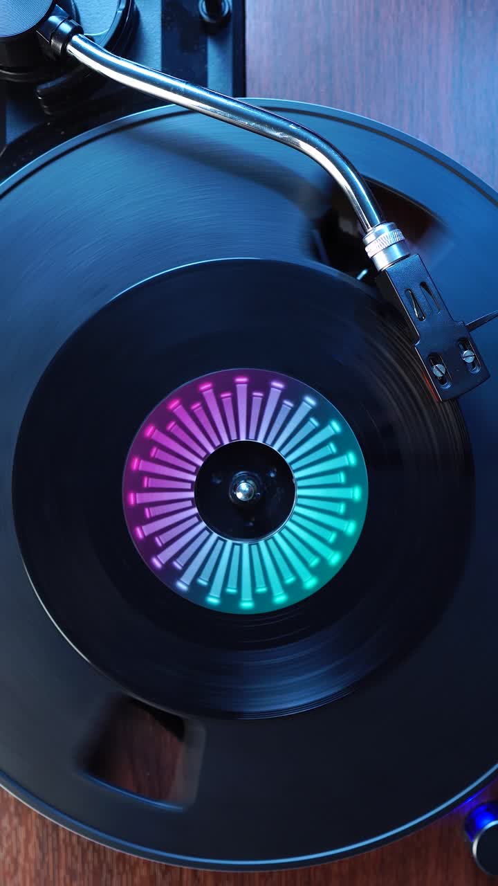 Vertical View, Starting Playback of Single Vinyl Record on Spinning Turntable, Top Down