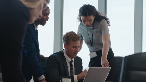 business people meeting team leader woman training colleagues using laptop computer pointing at screen sharing ideas discussing project in office boardroom 4k