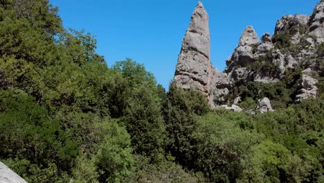 Flying-over-a-rocky-peak-and-sea