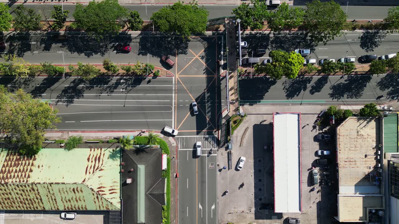 Overhead View Of Cars Driving On The Main Road In Greenhills, San Juan, Metro Manila, Philippines. - aerial shot