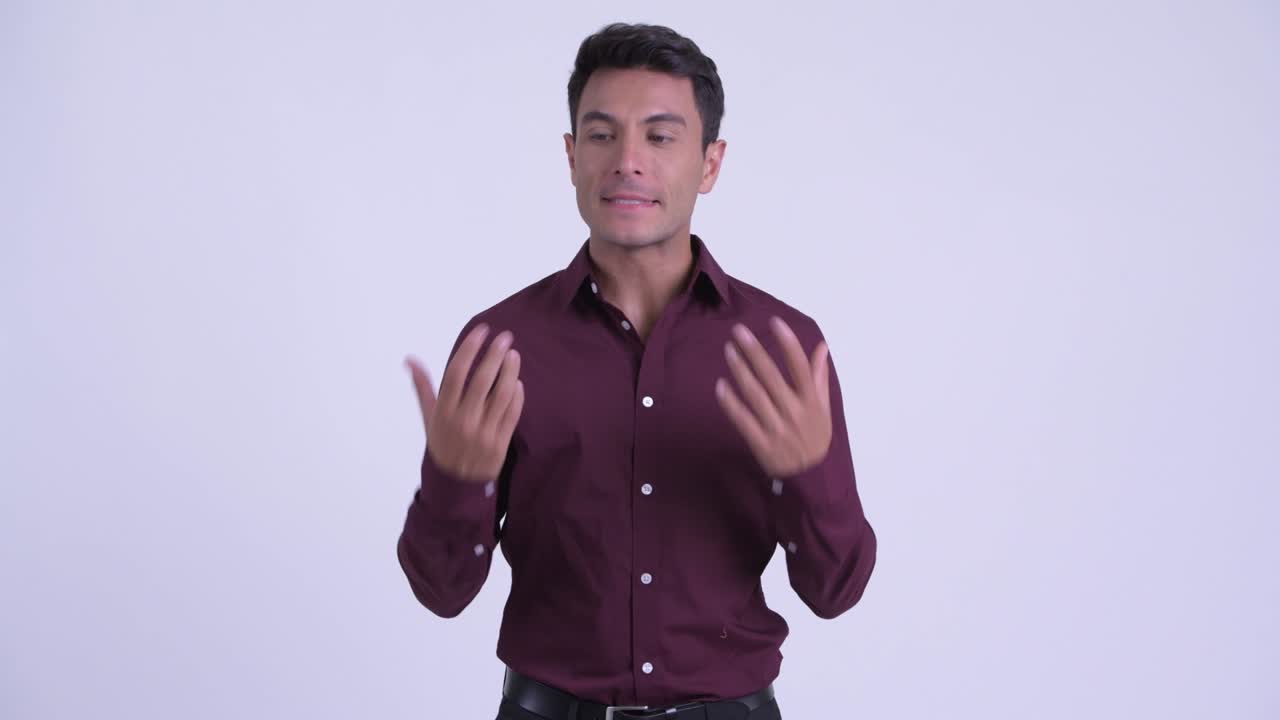 Young handsome Hispanic businessman