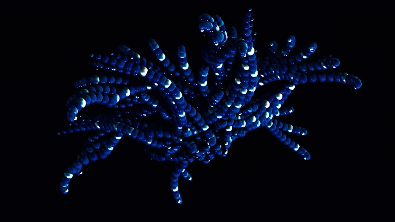 Abstract colorful star fish shaped figure formed by small gathered spheres moving on black background, seamless loop. Animation. Blue circles moving fast