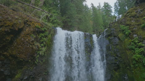 slow pedestal shot up lower section of falls creek falls in gifford pinchot national forest, revealing upper level of waterfall.