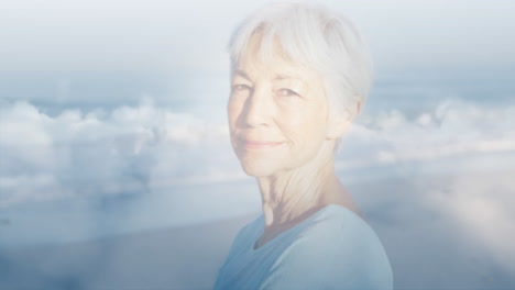 animation of glowing light over portrait of happy senior woman