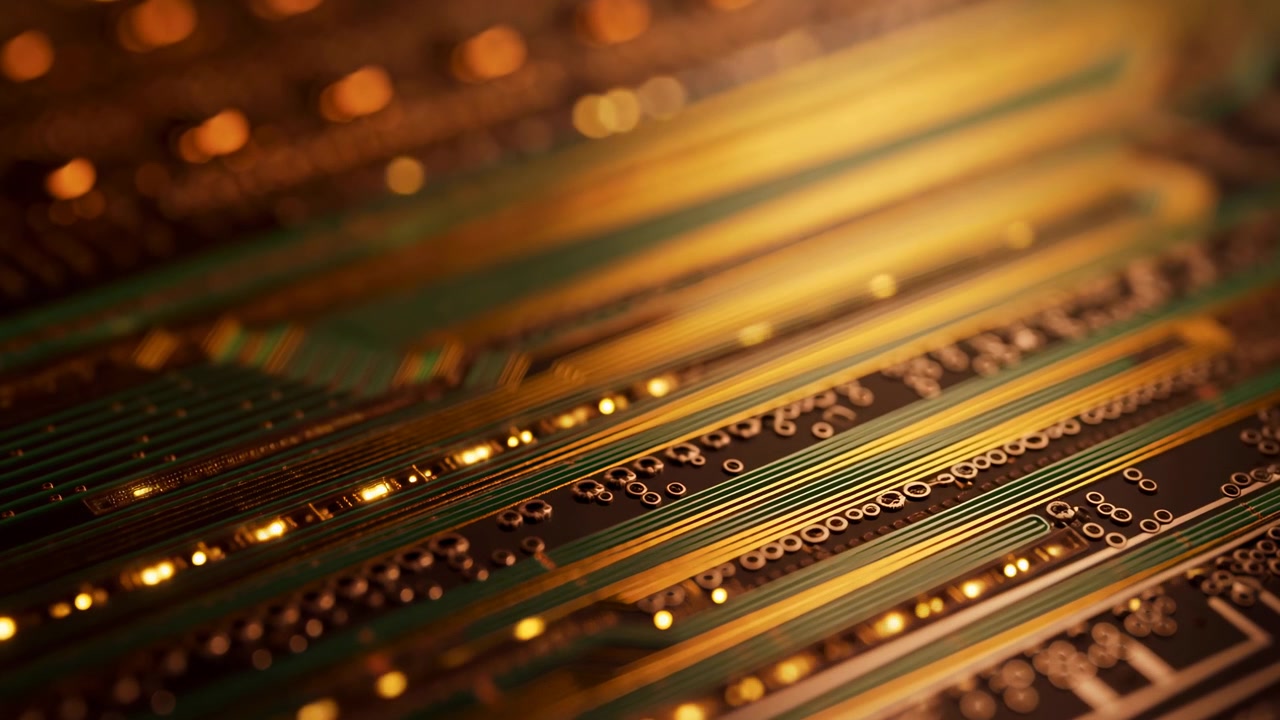 A close-up of a green circuit board fills the frame diagonally, with metallic traces, tiny components, and warm golden highlights concentrated toward the