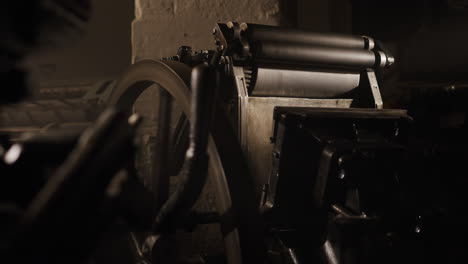 vintage printing press in a dark room