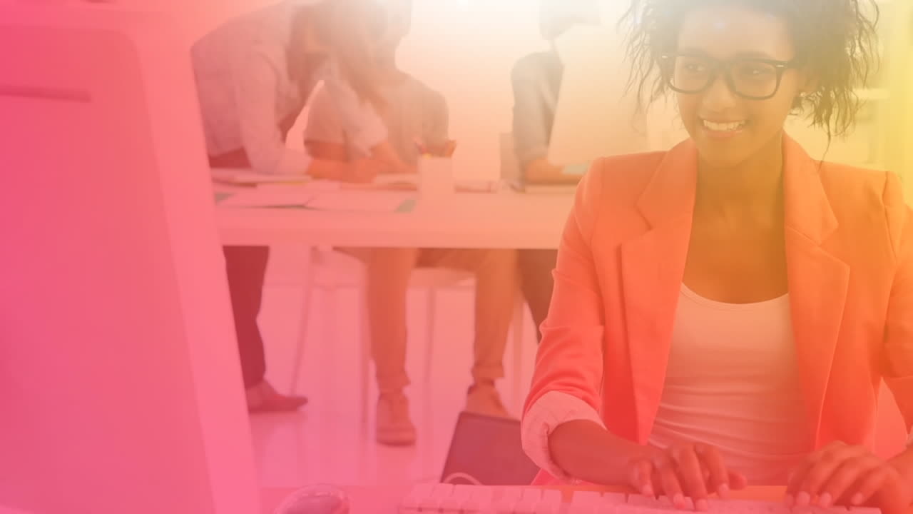 Animation of woman working in office using computer with yellow to pink tint