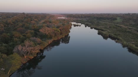 forward descending aerial drone shot of the komati river and bushveld in south africa, early morning