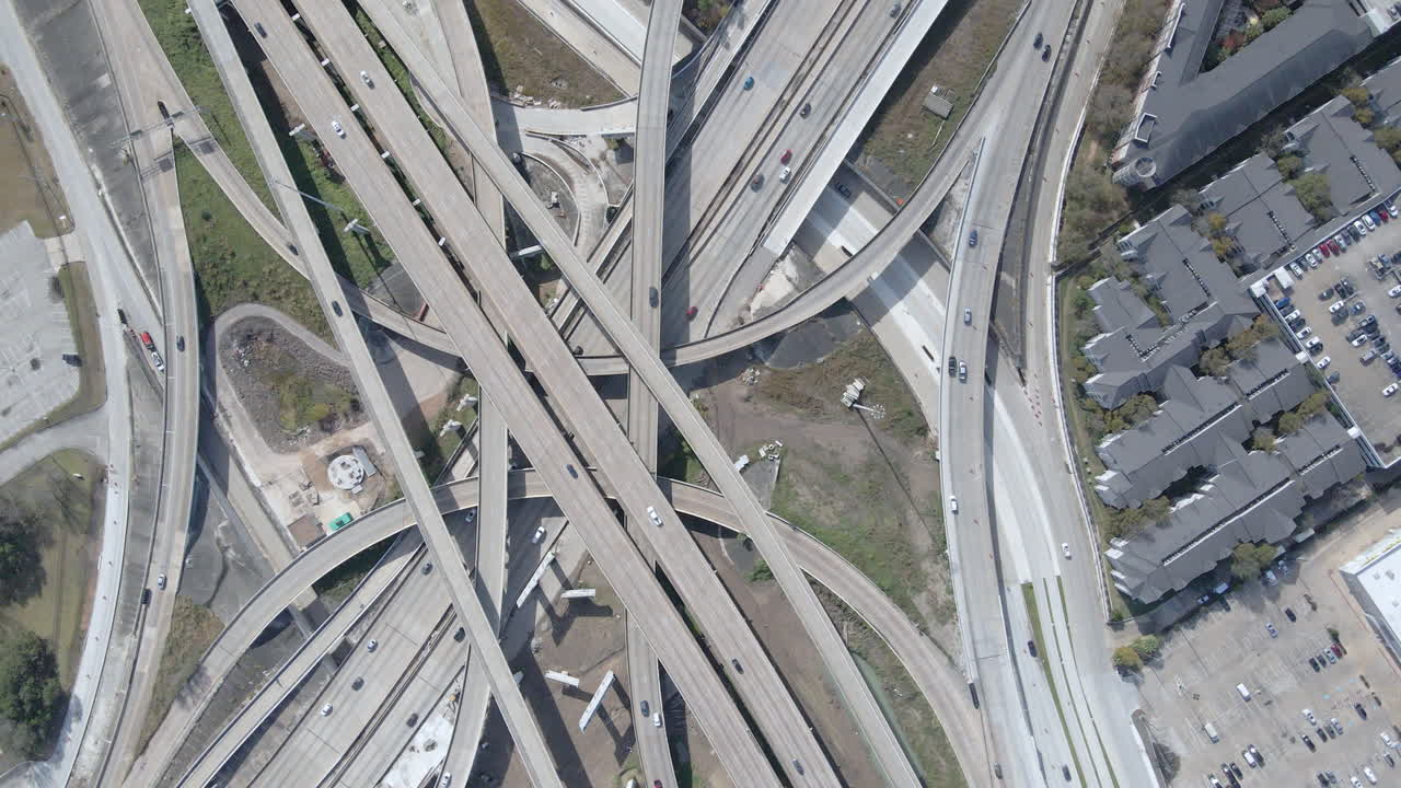 Massive Houston Freeway Intersection. Huge Highway intersection of I69 and I610. Top down aerial shot of the I610 and I69 Interchange in Texas. Establishing Drone Shot.