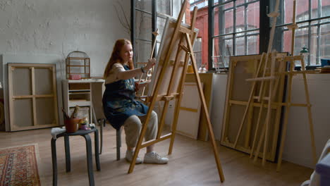 artist painting on a canvas