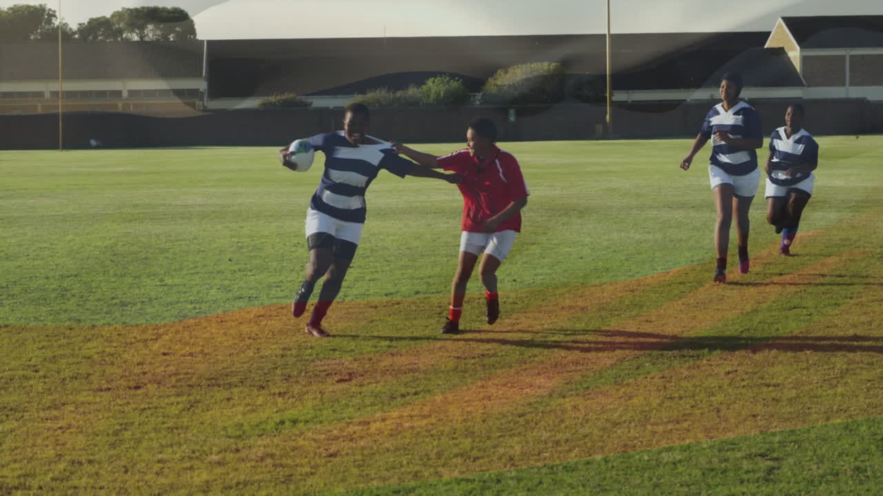Playing rugby on grassy field, athletes competing in intense match