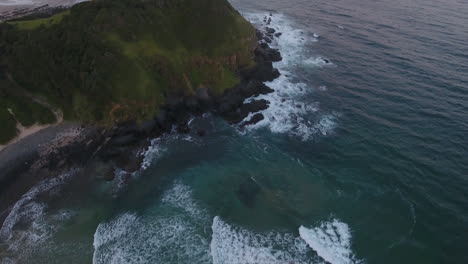 Cinematic-aerial-flying-at-sunrise-over-coast-of-East-London-South-Africa