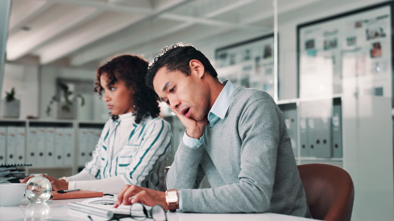 Two people working in an office
