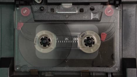 audio cassette tape playing till the end, close up