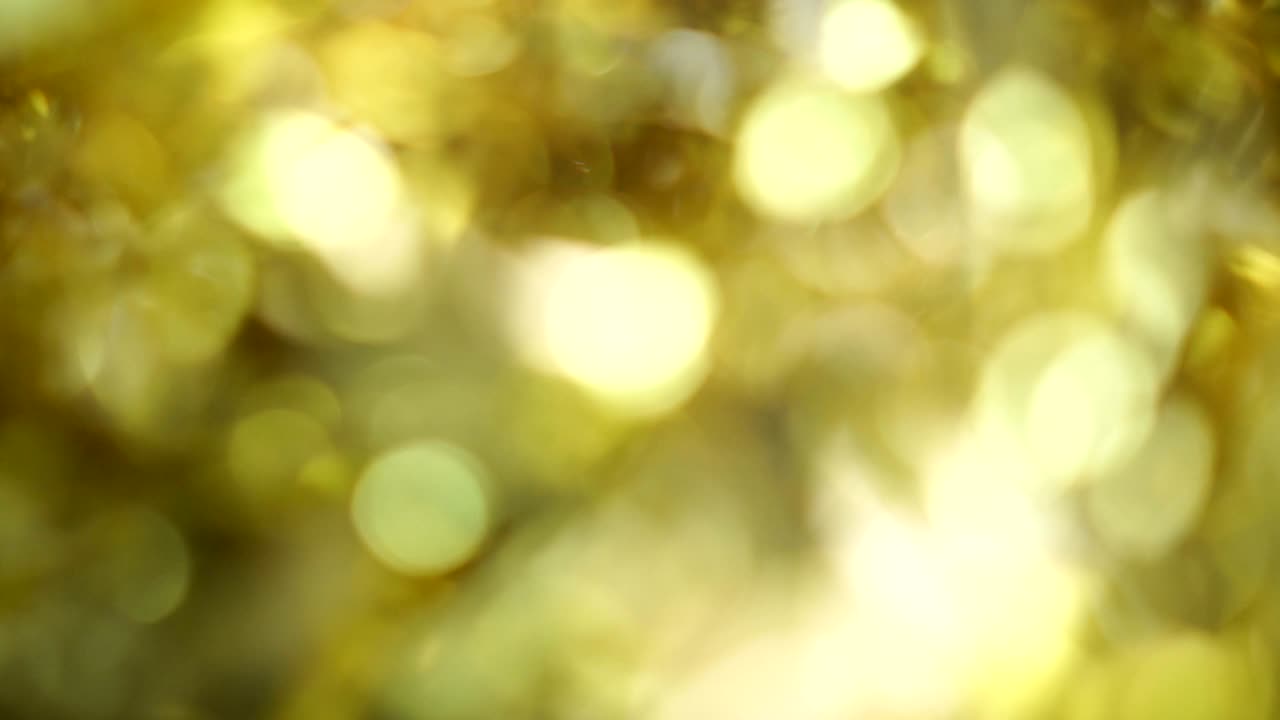 fondo borroso de luz bokeh de color dorado, popular en el festival general. hacer la imagen de lujo en su pieza de trabajo.