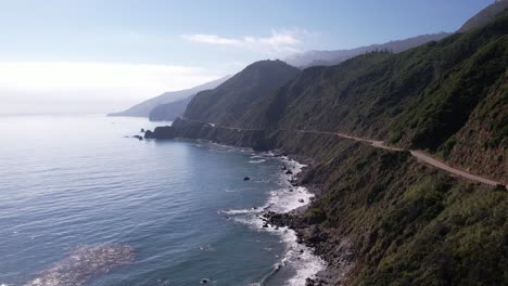 aerial drone shot flying up highway 1 on the pacific coast near big sur, california