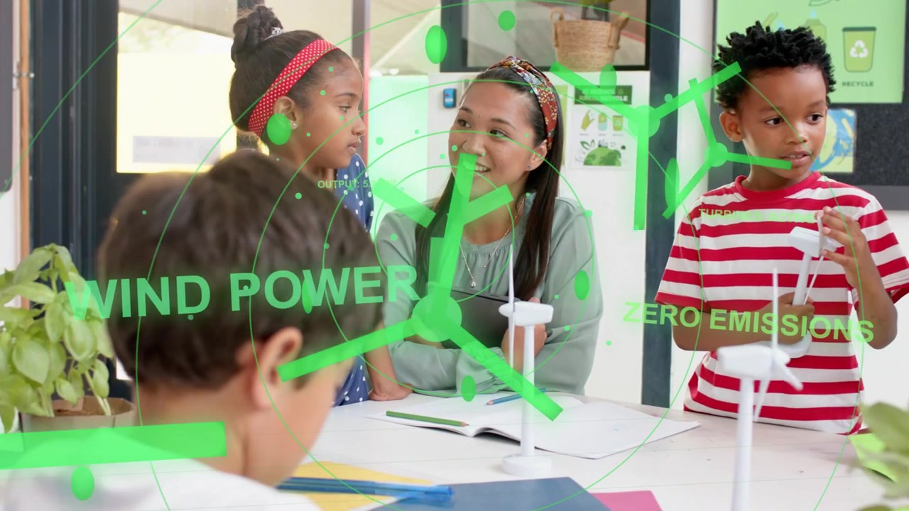 Boy writing while green overlay appearing adding turbine icons, teacher guiding wind power lesson