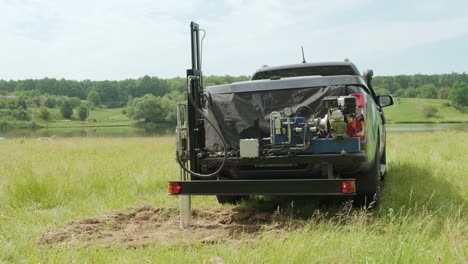 soil examination of agronomy. geotechnical investigation. collecting black soil on the field for examination and analysis. special equipment for pickup