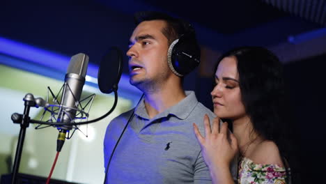 couple singing in recording studio