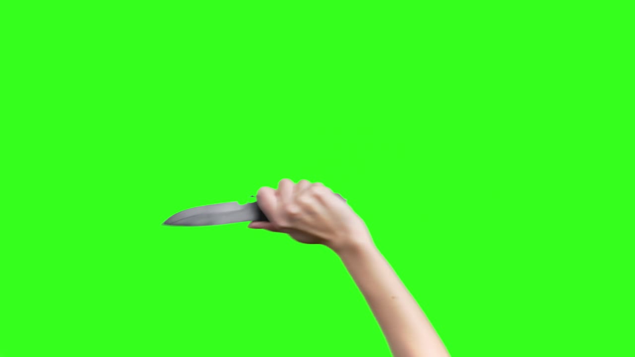 초록색 배경에 칼로 여성의 손을 는