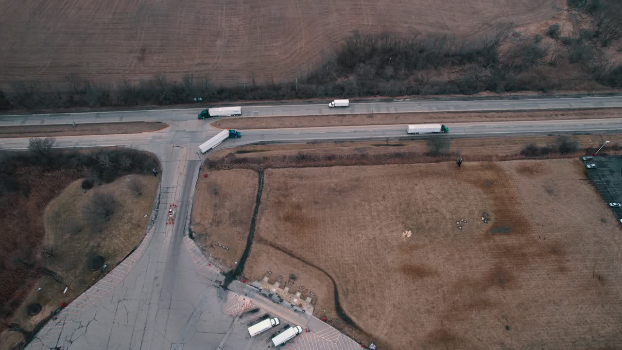 Semi truck exiting truck stop and makes a right turn