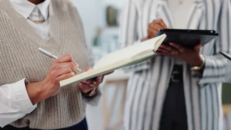 businesswomen collaborating on plans in office