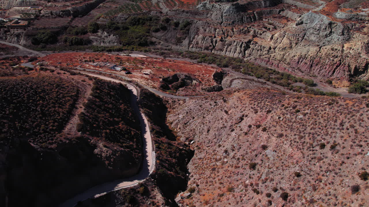 Aerial view of Tabernas, Almeria, Spain. Camera tilting up to reveal the desert and town