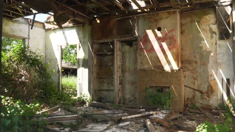 abandoned house interior with sunlight and debris