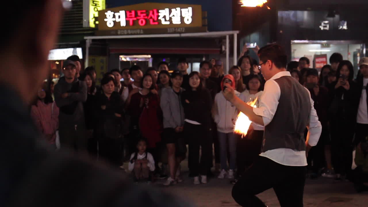 Fire Juggler Performance in a City Street