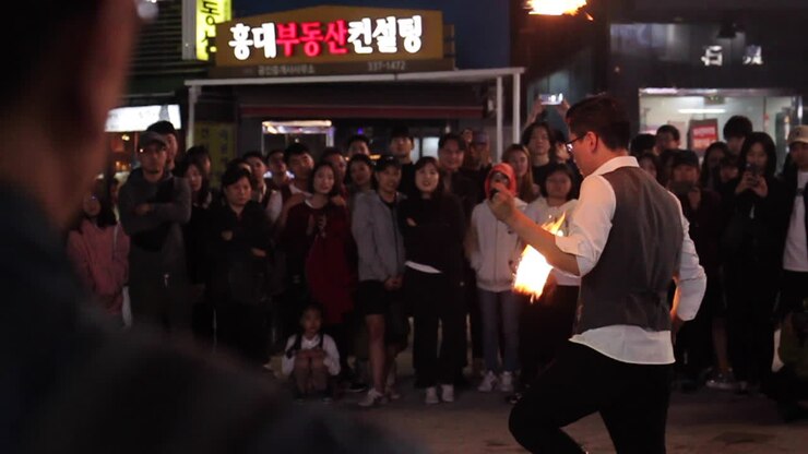 Fire Juggler Performance in a City Street