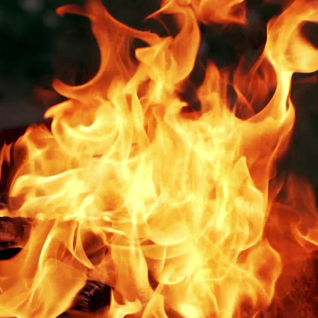 Burning wood bonfire in brazier outdoor. Flames fire BBQ in nature. Preparation for cooking barbecue outside, summertime