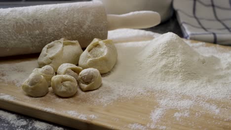 homemade dumplings and pastries on a wooden board