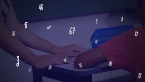 animation of numbers and symbols floating over diverse female teacher teaching a boy at school