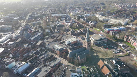 aerial orbit of large church in an old town center in barneveld, the netherlands