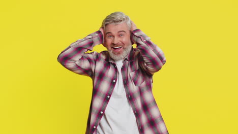 happy mature man celebrating success winning victory lottery jackpot goal achievement good news