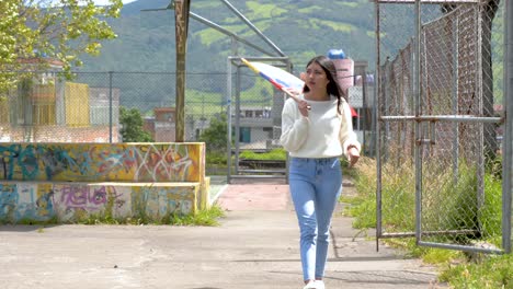 hopeful patriotic latin america woman outside waving flag from ecuador