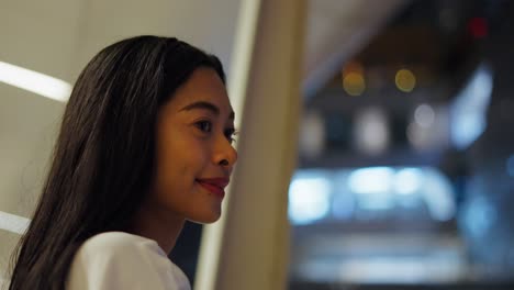 woman smiling at night city view
