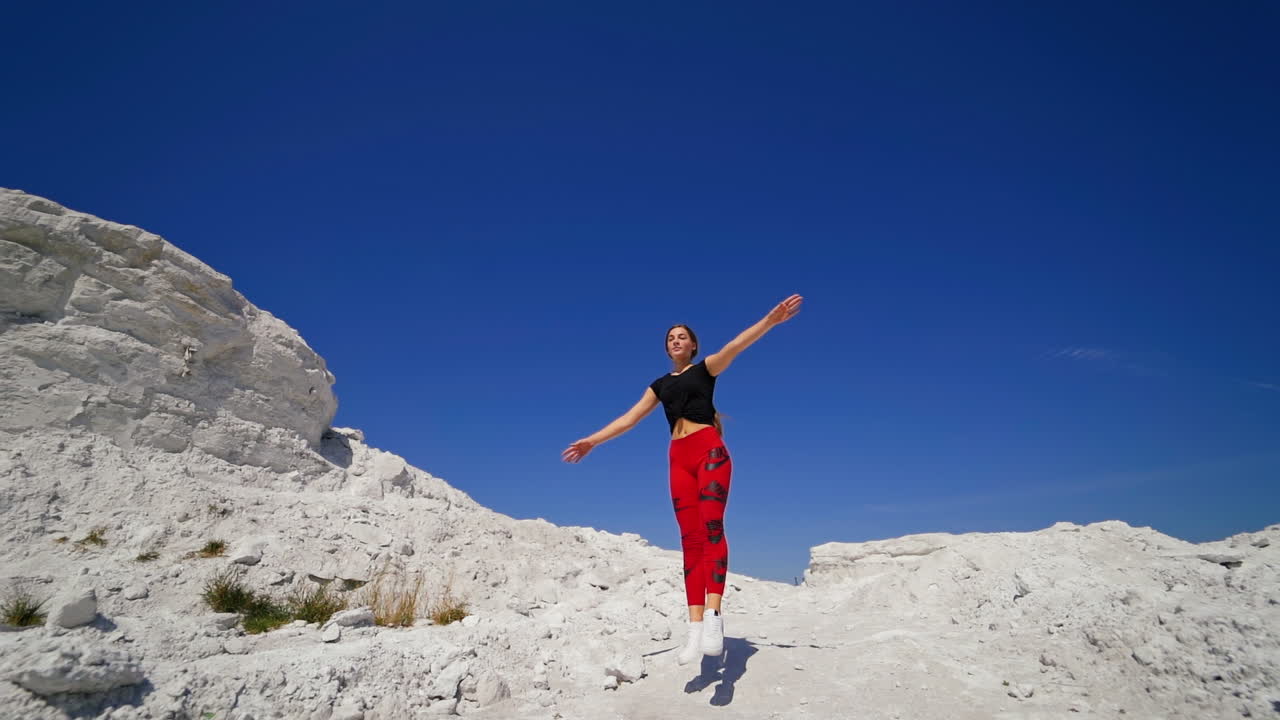 Woman Running in a Rocky Landscape