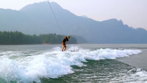 man wakeboarding in the river 4k