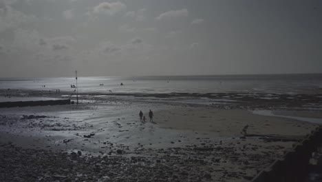 bright light reflected on the low tide water in hunstanton beach england uk during summer day