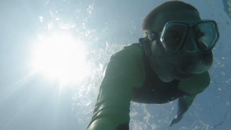 taking a dive in the beautiful, clear, transparent waters of thailand, an ocean adventure - underwater