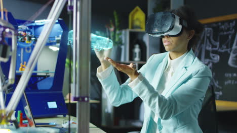 woman using vr headset to interact with a 3d model in a tech lab