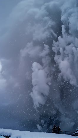 massive avalanche in winter mountain