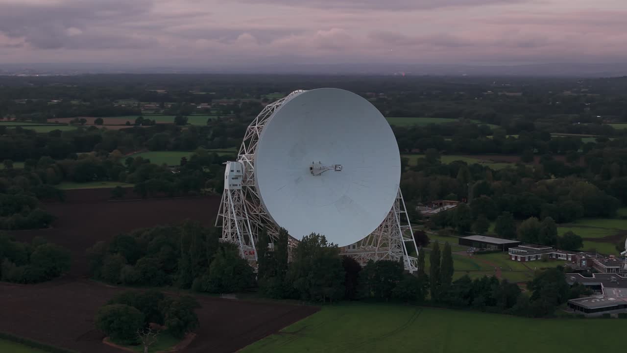 Lovell Telescope at Jodrell Bank Observatory, set in a lush green landscape