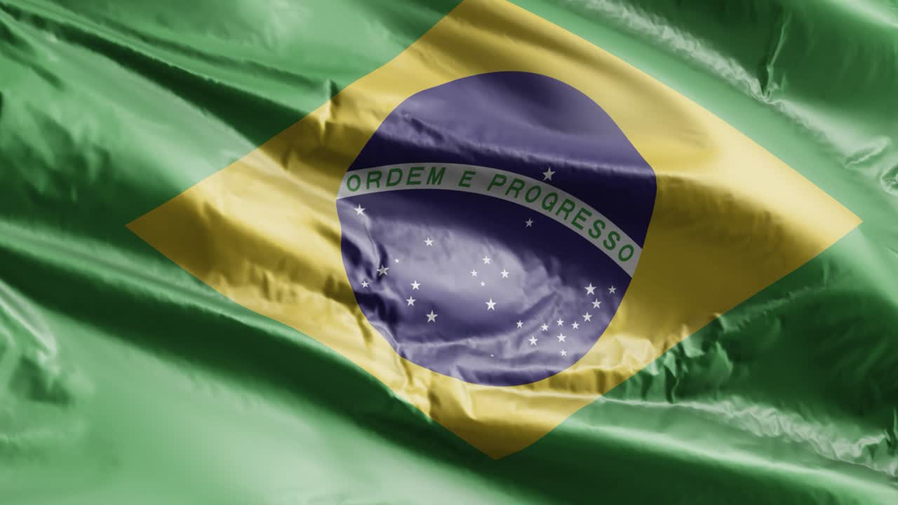 Bandiera del Brasile che sventola lentamente al vento in loop. Stendardo brasiliano che ondeggia dolcemente con la brezza. Sfondo a pieno schermo. Loop di 20 secondi.