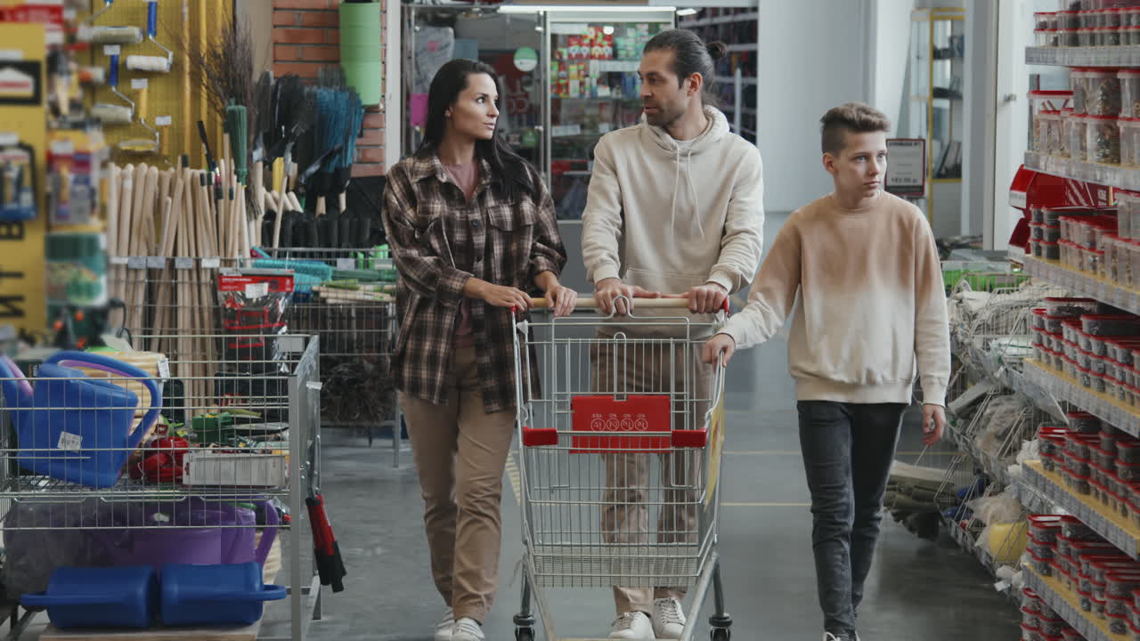 Family of Three Walking through Hardware Store